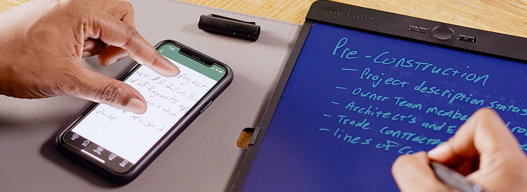 Close up view of someone using the Blackbaord App while reviewing notes on Blackboard Letter